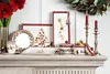 A collection of Christmas-themed tableware arranged on a mantelpiece. Náhľad obrázku produktu