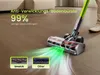 A vacuum cleaner head with green light effects on a wooden floor, with two inset images showing different brush heads. Produktbild-Vorschau