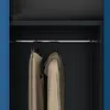Interior view of a wardrobe with clothes hanging on a rod. Produktbild-Vorschau