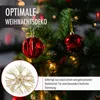 A close-up of a decorated Christmas tree with red ornaments and a straw star. Produktbild-Vorschau