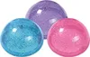 Three glittery bouncy balls in blue, purple, and pink are arranged in a cluster on a white background. Produktbild-Vorschau