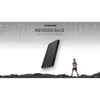 A Nitecore power bank is shown floating above a rocky surface with a runner in the background. Náhled obrázku produktu