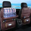 Car interior with organizers on the back of seats, holding water bottles and tissues. Podgląd zdjęcia produktu