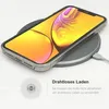 A smartphone is placed on a wireless charging pad, with text and an icon indicating wireless charging. Produktbild-Vorschau