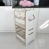 A white learning tower with cloud cutouts is shown in a kitchen setting. Náhled obrázku produktu