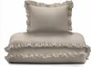 A stack of taupe bedding with ruffles, including a pillow and a duvet or comforter. Produktbild-Vorschau