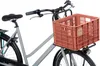 A close-up view of a bicycle with a terracotta-colored crate attached to the front. Náhled obrázku produktu
