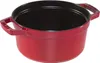 A red cast iron pot with black interior, shown from a slightly elevated side view against a white background. Náhľad obrázku produktu