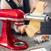 A person is using a red KitchenAid stand mixer with a pasta roller attachment to make pasta. Anteprima dell’immagine prodotto
