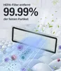 A HEPA filter is shown, with text indicating it removes 99.99% of fine particles. The filter is positioned over a textured surface with stylized representations of viruses and particles being drawn towards it. Produktbild-Vorschau