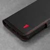 A close-up shot of a black leather wallet case for a smartphone, featuring red stitching and a small red bull logo. Produktbild-Vorschau