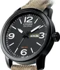 A close-up, angled view of a Citizen Eco-Drive watch with a black face and a tan fabric strap. Produktbild-Vorschau