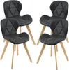 Four black chairs with wooden legs are arranged in a studio setting against a white background. Produktbild-Vorschau
