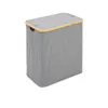 A gray laundry sorter with a wooden trim and lid, shown against a white background. Produktbild-Vorschau
