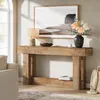A console table with a lamp, vase of flowers, and a framed picture in a well-lit room. Produktbild-Vorschau