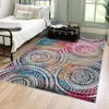 A bedroom with a bed, a trunk, and a colorful rug. Podgląd zdjęcia produktu