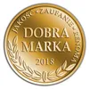 A gold-colored medal or award with text and laurel branches. Produktbild-Vorschau