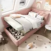A child's bedroom with a pink upholstered bed, open storage revealing stuffed animals, and decorative wall art. Produktbild-Vorschau