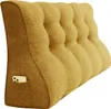 A yellow wedge pillow with a textured fabric and a pocket on the side holding a smartphone. Náhled obrázku produktu