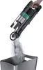 A hand is holding a cordless vacuum cleaner, emptying dust into a bin. Produktbild-Vorschau