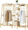 A bamboo garment rack with various clothing items and storage boxes. Anteprima dell’immagine prodotto