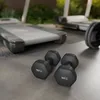 Dumbbells and treadmills in an outdoor gym setting. Produktbild-Vorschau