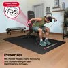 A man is using a weight bench with resistance bands in a home gym setting. Produktbild-Vorschau