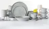 A collection of grey porcelain dinnerware, including plates, bowls, and cups, arranged on a white surface. Produktbild-Vorschau