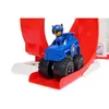 A toy police car with a dog figurine driving it, on a red and white ramp. Náhľad obrázku produktu