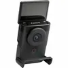 A black Canon PowerShot V10 compact camera is shown standing upright on a black stand against a white background. The screen is flipped up. Podgląd zdjęcia produktu