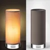 Two identical lamps, one lit and one unlit, are shown side-by-side against different backgrounds. Produktbild-Vorschau