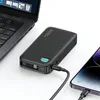 A black power bank is shown charging a smartphone and a laptop. Náhled obrázku produktu
