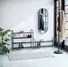 A hallway or entryway with shoe racks, a coat rack, and a mirror. Náhľad obrázku produktu