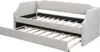 A beige upholstered daybed with a pull-out trundle bed is shown from a diagonal angle. Náhľad obrázku produktu