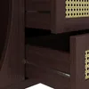 Close-up of open drawers on a dark wood cabinet with rattan accents. Anteprima dell’immagine prodotto