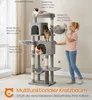 A woman is interacting with a multi-level cat tree that has several cats on it. The cat tree is in a room with a window and curtains. Produktbild-Vorschau