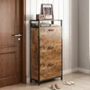 A shoe cabinet with three drawers is placed next to a wooden door in a hallway. Náhľad obrázku produktu