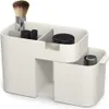 A white cosmetic organizer with several compartments, holding makeup brushes, lipstick, and jars. Náhled obrázku produktu