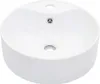 A white ceramic sink with two holes and a drain. Náhľad obrázku produktu