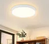 A white, circular LED ceiling light is mounted on a white ceiling. Anteprima dell’immagine prodotto
