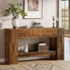 A wooden console table with decorative items and a framed picture above it, in a well-lit room. Produktbild-Vorschau