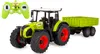 A remote-controlled tractor with a trailer and its remote control, displayed on a white background. Produktbild-Vorschau
