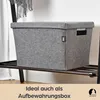 A grey felt storage box with a lid and handles sits on a shelf. Produktbild-Vorschau