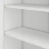 A close-up view of the interior of a white metal cabinet with shelves. Podgląd zdjęcia produktu