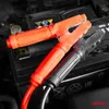 Close-up of car battery jumper cables connected to a car battery. Podgląd zdjęcia produktu
