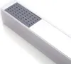 A close-up, angled view of a modern, rectangular shower head with a gray perforated panel. Voir les images du produit