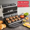A grill with burgers, buns, and toppings on a countertop. Produktbild-Vorschau