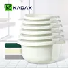 A stack of white plastic bowls is shown in the foreground, with a logo and text in the upper left corner. Three colored bars are on the left side. Produktbild-Vorschau