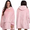 A woman wearing a pink hoodie blanket, shown from the front and back. Produktbild-Vorschau