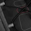 A close-up view of a black backpack with elastic cords and reflective strips. Produktbild-Vorschau